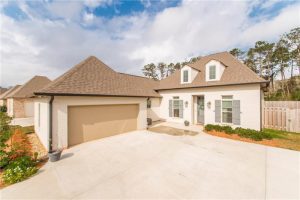A four bedroom three bath home that has a side entry garage.