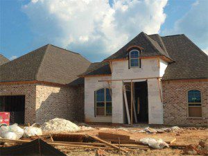 1057 Cypress Crossing is under construction in Madisonville, close to New Orleans. Beautiful arched windows and brick exterior are just two custom features.