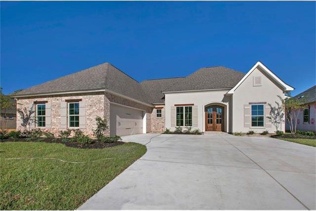 Side entry garage that can store two cars. The garade with a side entry does not take away from the front exterior view. This new construction home is located close to New Orleans.
