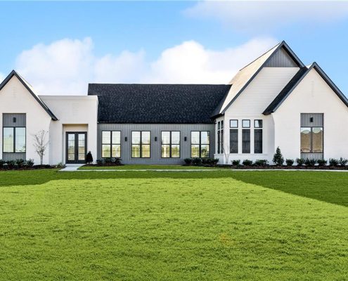 Its symmetrical design and clean lines create a sleek yet inviting curb appeal perfect for contemporary living.