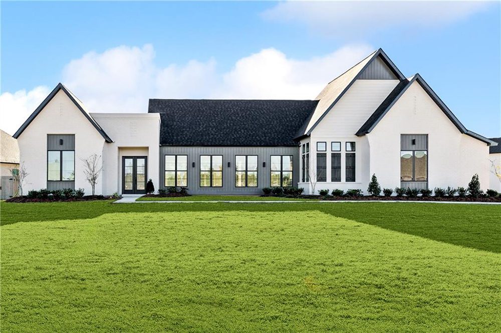 1-1174 Audubon Pkwy Its symmetrical design and clean lines create a sleek yet inviting curb appeal perfect for contemporary living.