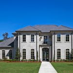 This French Provincial home is a 2-story custom built home that is located close to New Orleans.