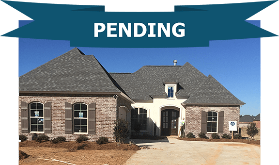 1008 Cypress Crossing with architectural roof upgrade. Large new home in the master planned community Bedico Creek located in Madisonville. Side entry garage making the front elevation look very large.