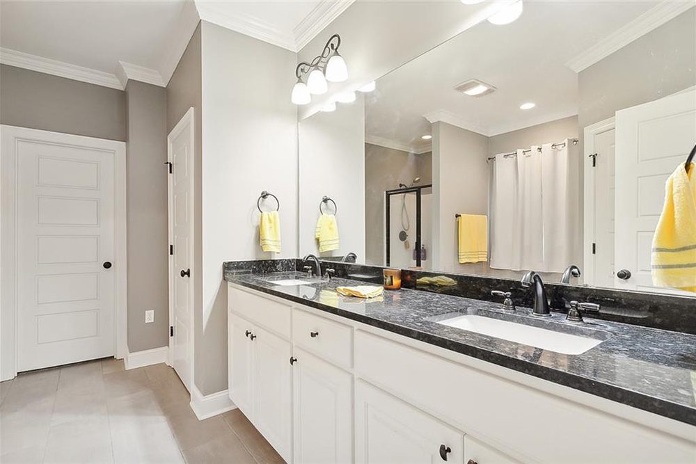 11-3033 Lost Lake Primary Bathroom Thoughtfully designed with ample storage and a clean, modern look, this bathroom is the perfect retreat for relaxation and daily routines.