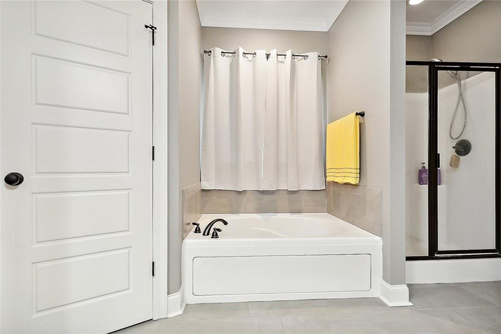 12-3033 Lost Lake Soaking Tub With its clean lines, thoughtful layout, and calming aesthetic, this bathroom is designed for both relaxation and style.