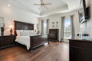 Shiplap accent on the ceiling int he master suite. The master bedroom has hardwood flooring.