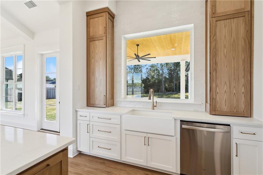 13-Cabinet Space 1174 Audubon Pkwy A large window above the sink provides beautiful views of the backyard and covered patio, making this spot both functional and scenic.