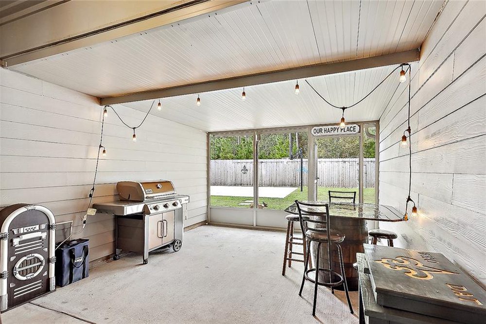 19 -3033 Lost Lake Screen in Patio The fenced backyard provides privacy, while the large open-air windows bring in natural light, making it an inviting gathering space.