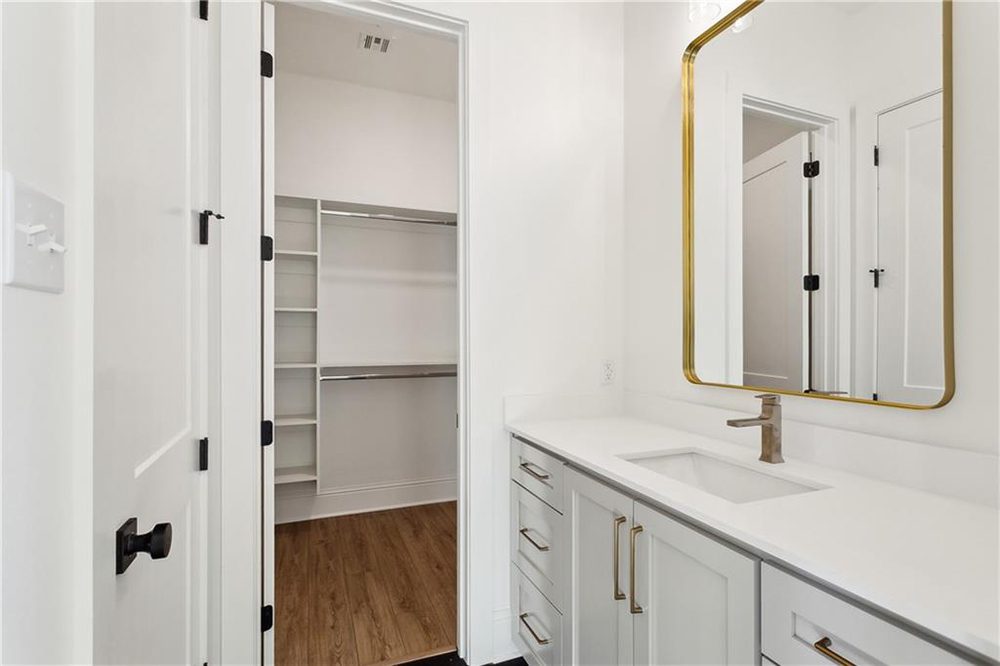 26-Primary Bathroom 1174 Audubon Pkwy Practical yet luxurious, this space offers a seamless flow between self-care and wardrobe access, ideal for busy mornings or relaxed routines.