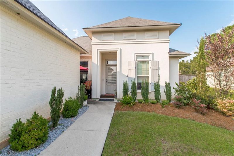 This home has a wonderful front yard with professional landscaping and a courtyard.