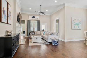 Bright and open family room with recessed lighting and hardwood floors.