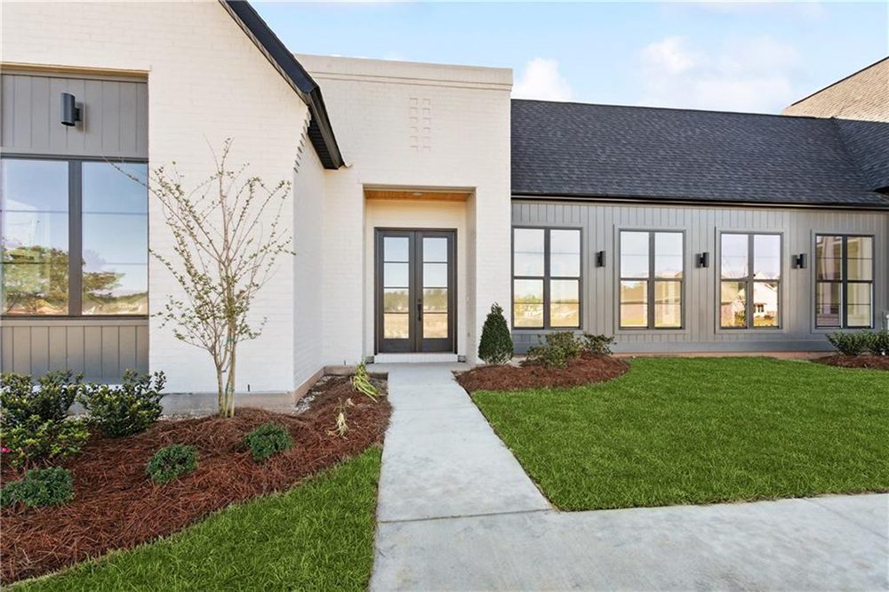 3-Landscaping 1174 Audubon Pkwy Carefully manicured landscaping with fresh pine straw mulch and young shrubbery adds warmth and curb appeal to the clean architectural lines.