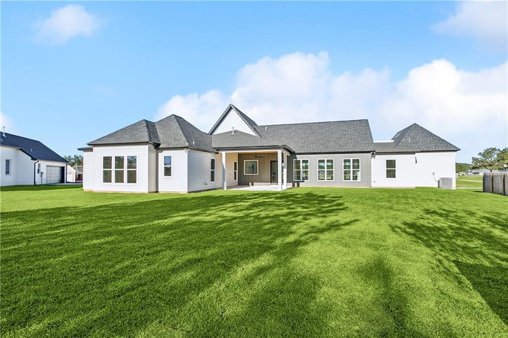 31-Yard 1174 Audubon Pkwy Ample windows along the back of the home promise light-filled interiors and easy indoor-outdoor flow. With privacy fencing enclosing the sides and wooded views beyond, this backyard delivers both openness and seclusion—perfect for enjoying the outdoors in comfort and style.