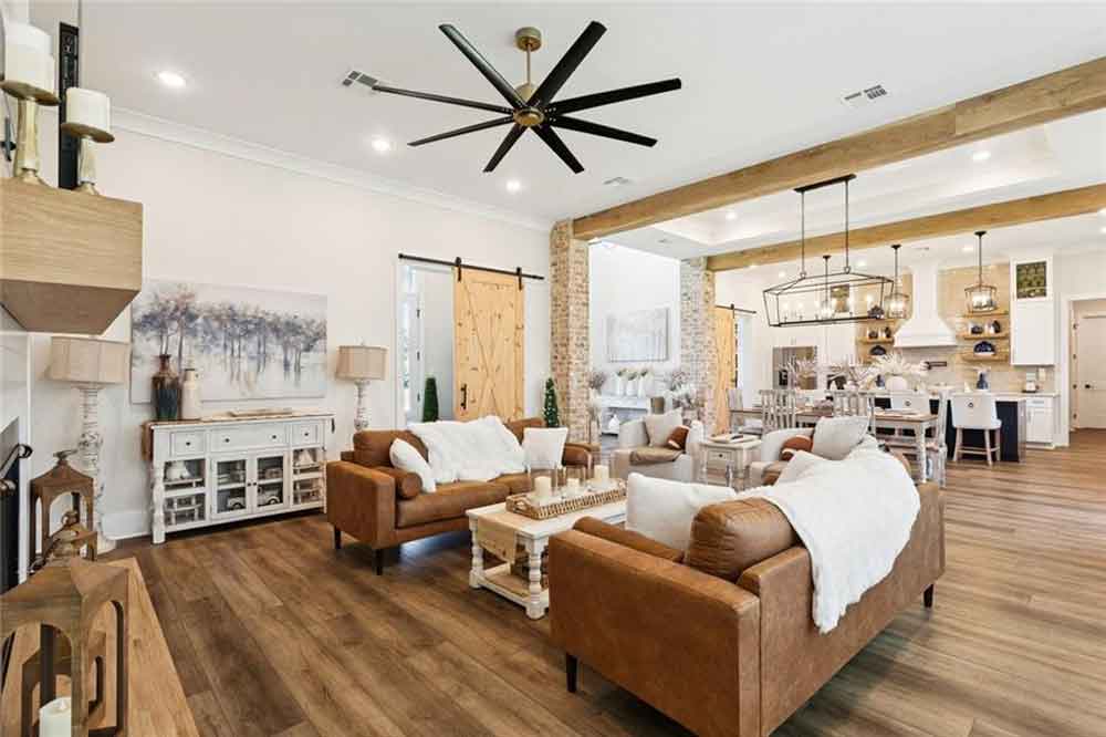 Stylish barn doors and farmhouse-inspired furnishings add warmth and character, creating a perfect balance of comfort and elegance.