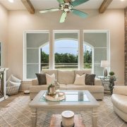 Open and bright family room with a brick accent wall.