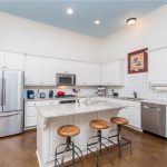 All stainless steel appliances and bar seating are just a few of the upgrades found in this kitchen.