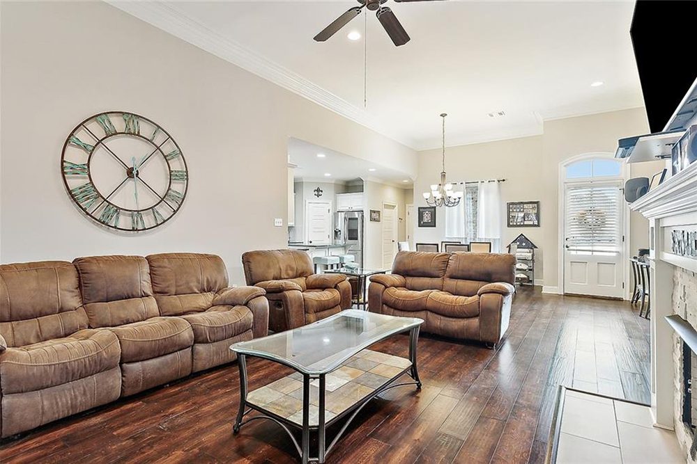 7-3033 Lost Lake Additional Livnng Room View The fireplace with a white mantel serves as a stylish focal point, complemented by a mounted TV for added functionality.