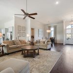 This home is so light and airy with tons of windows that let in the natural light. The custom home has hardwood floors throughout.